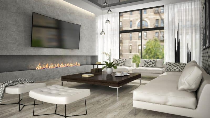 ribbon-fireplace-with-metal-and-glass-cascading-pendant-lights-and-metal-legged-tufted-leather-stools-and-printed-accent-wall-with-leather-seating